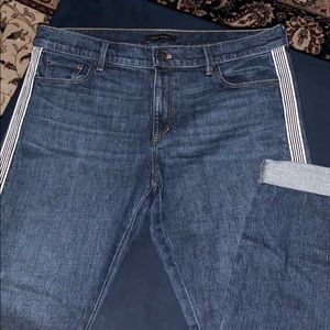 Ann Taylor dark wash jean with side stripe.